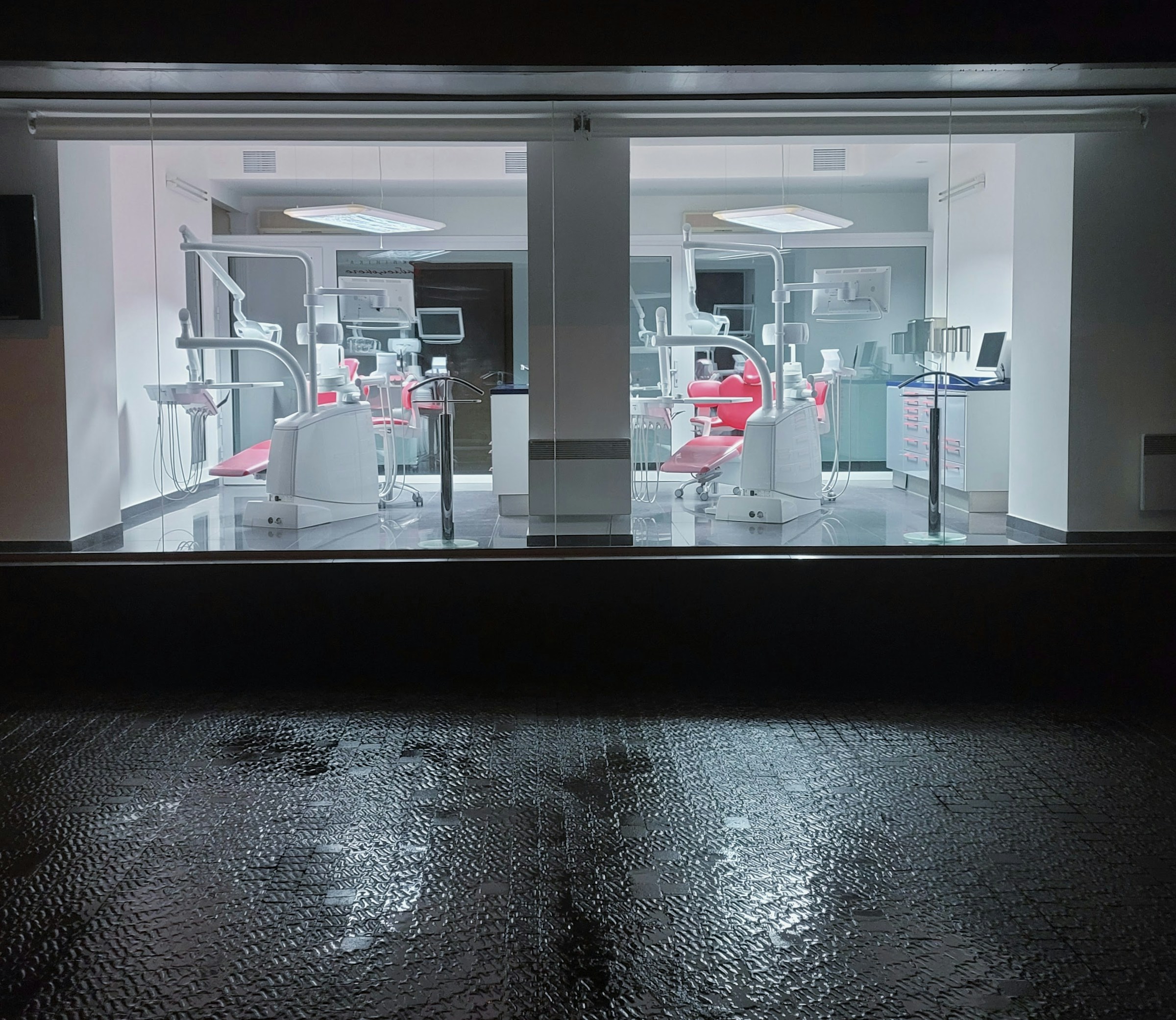Clinic seen through glass at night